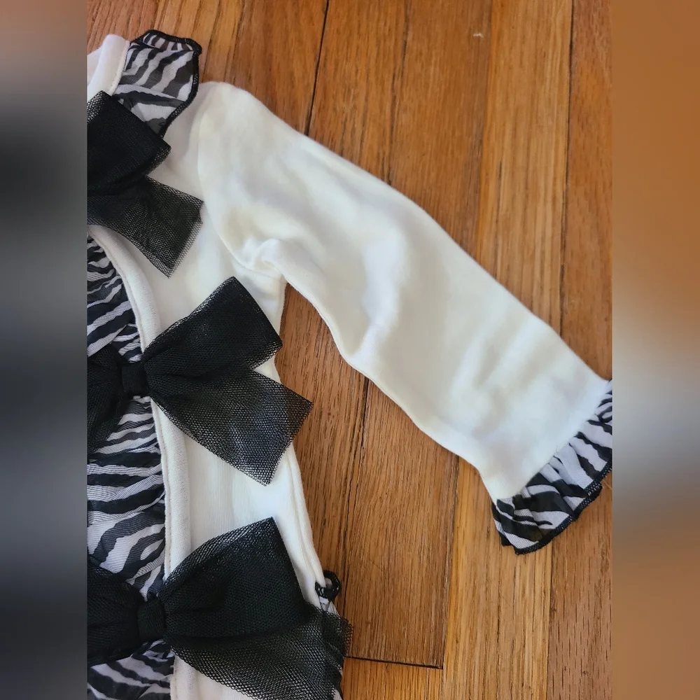 dressed to drool 6 months black and white romper with bows
